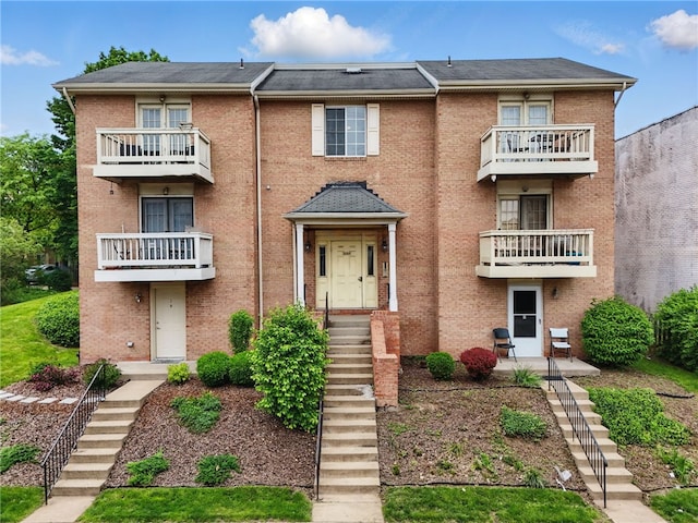 3289 Dawson St Unit 1, Oakland, PA 15213 - townhome / multi-family property with brick siding, stairway, and a balcony