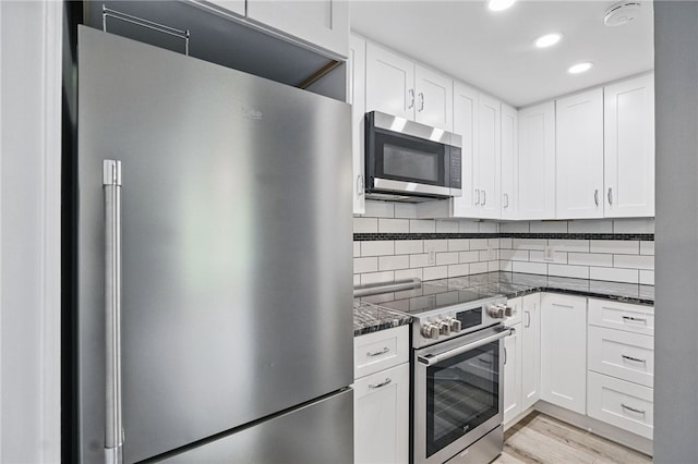 3289 Dawson St Unit 1, Oakland, PA 15213 - kitchen featuring appliances with stainless steel finishes, white cabinetry, backsplash, recessed lighting, and light wood-type flooring