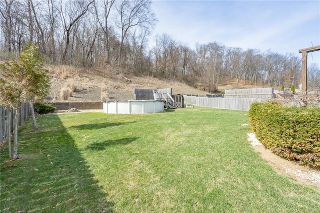 view of yard featuring a covered pool