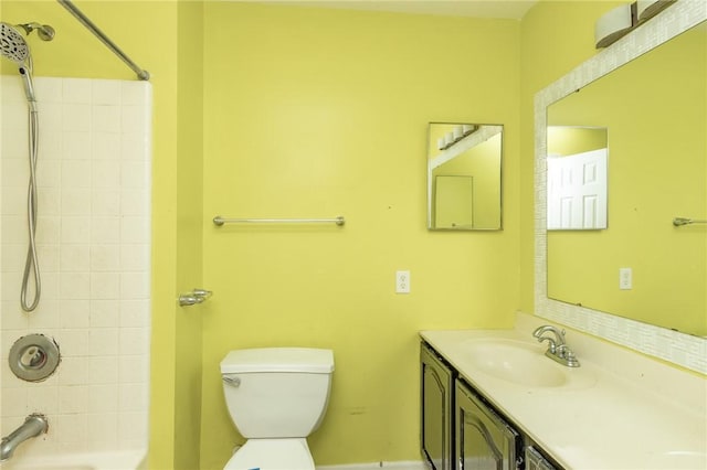 full bath featuring toilet, vanity, and  shower combination