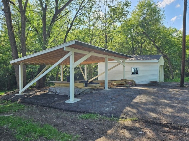 view of parking / parking lot with a carport