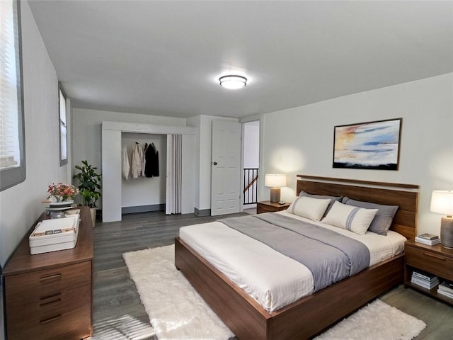 bedroom featuring dark wood-style floors and a closet