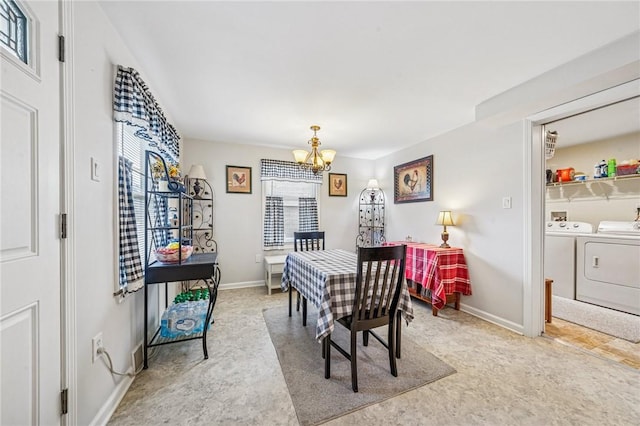784 Ohio River Blvd, Sewickley, PA 15143 - dining room featuring washer and clothes dryer, a chandelier, and baseboards