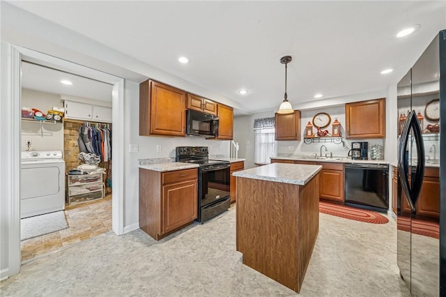 784 Ohio River Blvd, Sewickley, PA 15143 - kitchen featuring black appliances, washer / clothes dryer, a sink, brown cabinets, and recessed lighting