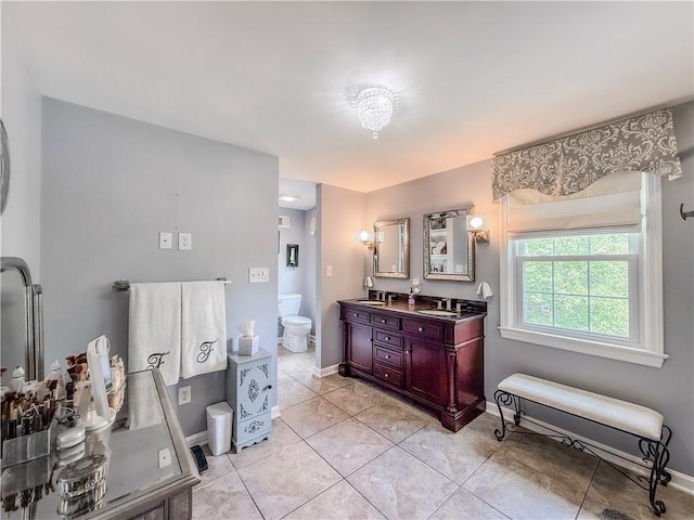 2388 Mill Grove Rd, Upper St Clair, PA 15241 - full bath with baseboards, tile patterned floors, double vanity, and toilet