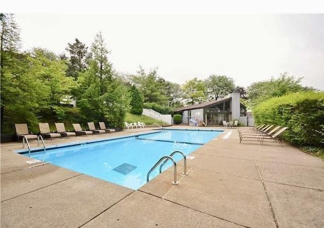 2034 Swallow Hill Rd Unit 329, Scott Twp Sal, PA 15220 - community pool with a patio area, fence, and view of wooded area