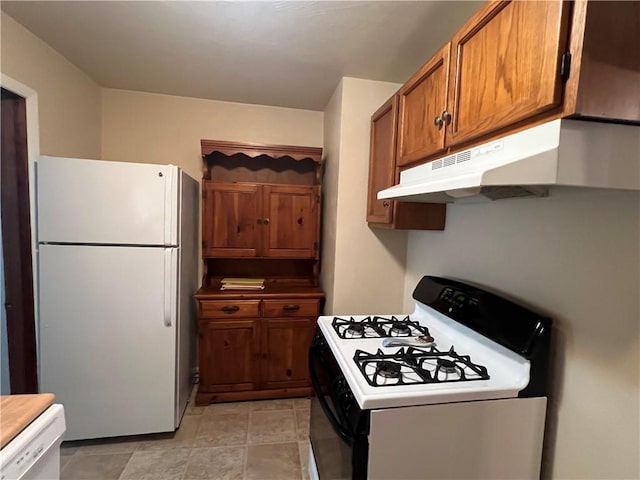 277 Widmer Ave, Lower Burrell, PA 15068 - kitchen with white appliances, under cabinet range hood, and brown cabinetry