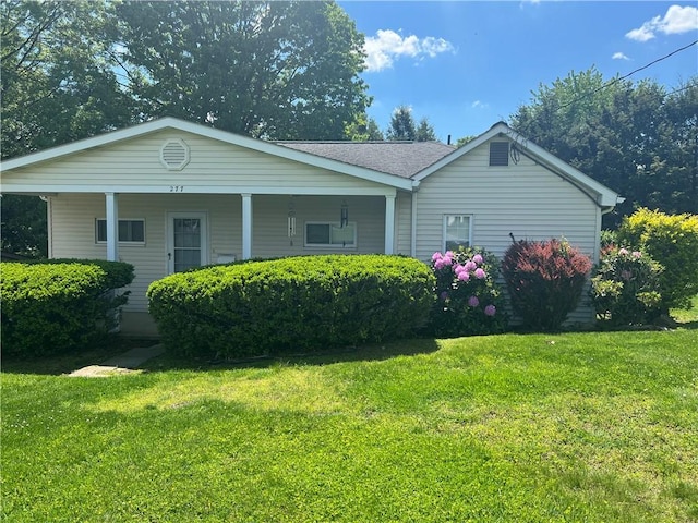 277 Widmer Ave, Lower Burrell, PA 15068 - view of home's exterior with a lawn and covered porch