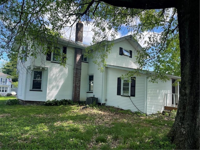 218 S Mercer, Linesville Boro, PA 16424 - rear view of property with central air condition unit, a chimney, and a lawn