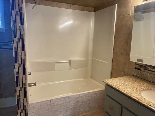 218 S Mercer, Linesville Boro, PA 16424 - bathroom featuring tiled shower / bath combo, vanity, and tile walls