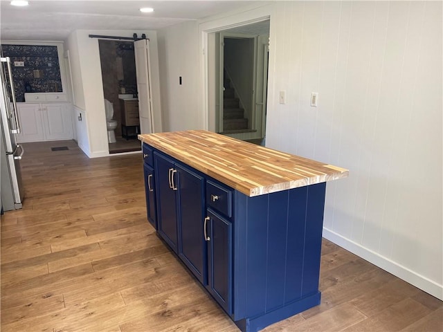 218 S Mercer, Linesville Boro, PA 16424 - kitchen featuring blue cabinetry, butcher block countertops, light wood-style floors, freestanding refrigerator, and baseboards