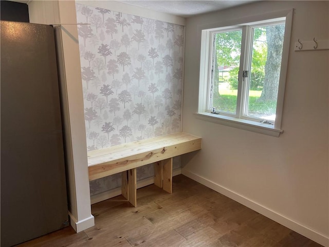 218 S Mercer, Linesville Boro, PA 16424 - unfurnished dining area with baseboards, wood finished floors, and healthy amount of natural light