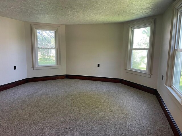 218 S Mercer, Linesville Boro, PA 16424 - carpeted spare room with a textured ceiling, baseboards, and a baseboard radiator