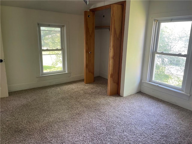 218 S Mercer, Linesville Boro, PA 16424 - unfurnished bedroom with multiple windows, light colored carpet, and a closet