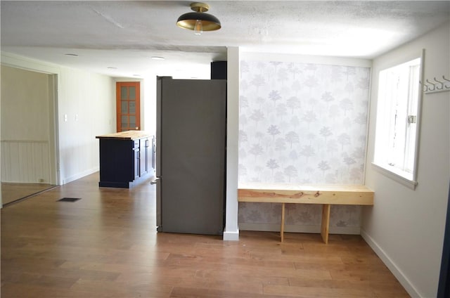 218 S Mercer, Linesville Boro, PA 16424 - spare room featuring wallpapered walls and wood finished floors