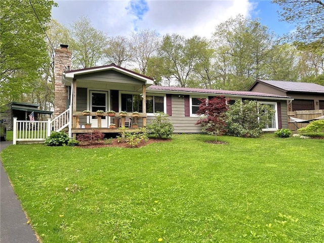 643 Laurel Summit Rd, Jenner Twp, PA 15531 - view of front facade with a chimney, a front yard, and covered porch