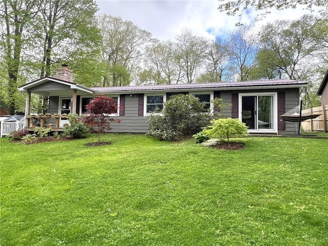 643 Laurel Summit Rd, Jenner Twp, PA 15531 - back of property featuring a chimney, metal roof, and a porch