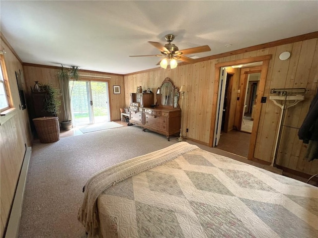 643 Laurel Summit Rd, Jenner Twp, PA 15531 - bedroom with access to exterior, wood walls, carpet floors, a ceiling fan, and baseboards