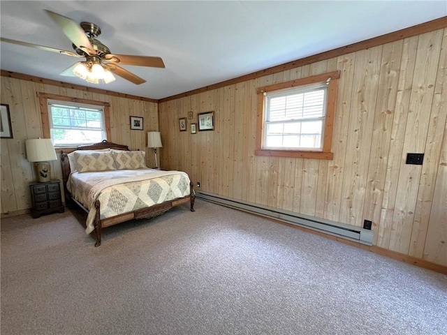 643 Laurel Summit Rd, Jenner Twp, PA 15531 - bedroom featuring a baseboard radiator, wooden walls, ceiling fan, and baseboards