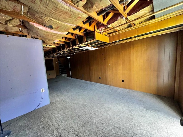 404 Belrose Dr, Rostraver, PA 15012 - unfinished basement featuring stairway, carpet flooring, and wood walls