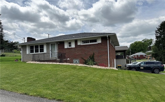 404 Belrose Dr, Rostraver, PA 15012 - view of front of house with brick siding, a front lawn, and a chimney