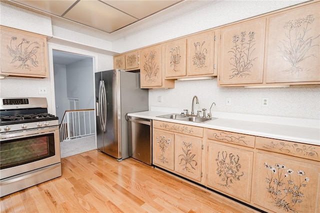 103 Shady Dr, White Twp Ind, PA 15701 - kitchen featuring stainless steel appliances, a sink, light countertops, and light wood finished floors