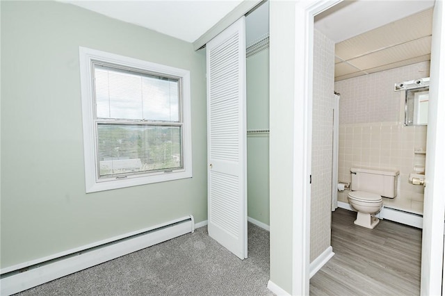 103 Shady Dr, White Twp Ind, PA 15701 - full bathroom featuring a baseboard heating unit, baseboard heating, toilet, tile walls, and baseboards