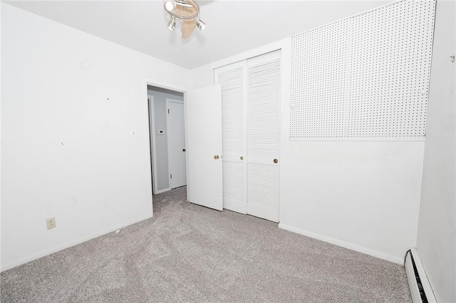 103 Shady Dr, White Twp Ind, PA 15701 - unfurnished bedroom featuring baseboard heating, carpet floors, a closet, and baseboards