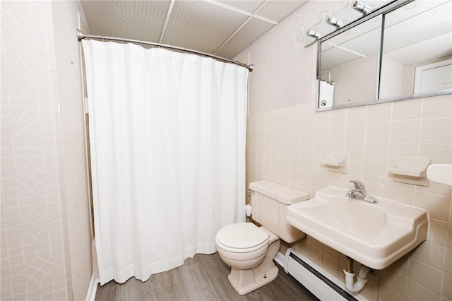 103 Shady Dr, White Twp Ind, PA 15701 - full bath featuring wood finished floors, toilet, tile walls, curtained shower, and a baseboard radiator