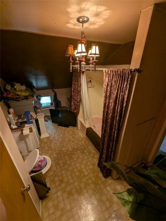 139 Stullville Rd, Leechburg Boro, PA 15656 - bathroom featuring shower / bathtub combination with curtain, a chandelier, and tile patterned floors