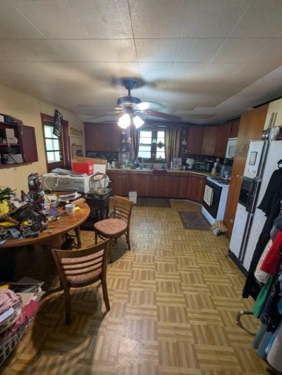 139 Stullville Rd, Leechburg Boro, PA 15656 - kitchen with white appliances and a ceiling fan