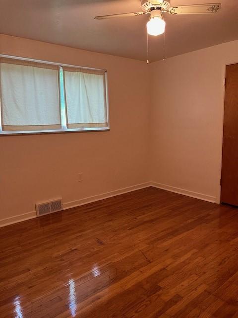 6729 Highland Ave, Union Twp Wsh, PA 15332 - spare room with dark wood finished floors, baseboards, and a ceiling fan