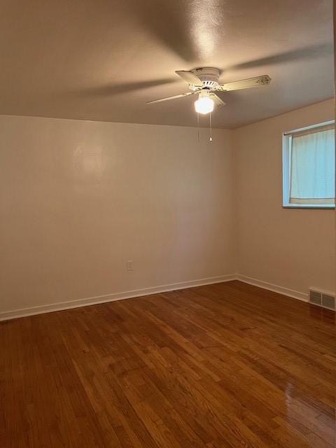6729 Highland Ave, Union Twp Wsh, PA 15332 - spare room featuring dark wood-style flooring, a ceiling fan, and baseboards