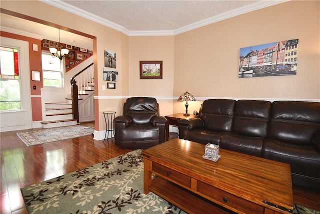 living area with wood finished floors, a chandelier, stairs, crown molding, and baseboards