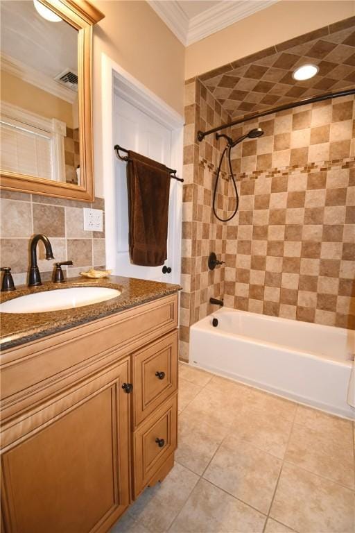 bathroom with bathtub / shower combination, ornamental molding, vanity, and tile patterned flooring