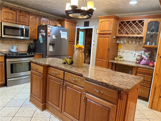 2650 Georgeville Rd, S Mahoning/Plumville, PA 15759 - kitchen with stainless steel appliances, brown cabinetry, decorative backsplash, and an ornate ceiling