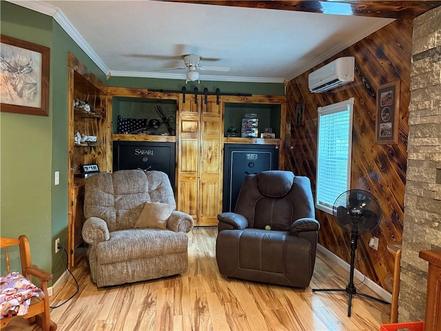 2650 Georgeville Rd, S Mahoning/Plumville, PA 15759 - living area with a wall unit AC, wood walls, wood finished floors, a barn door, and ceiling fan