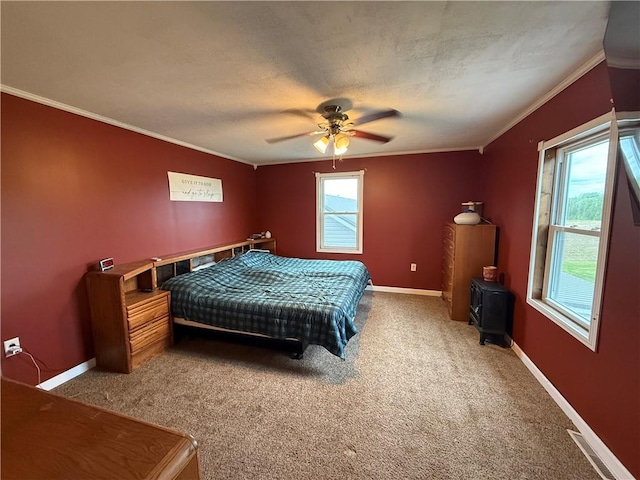 2650 Georgeville Rd, S Mahoning/Plumville, PA 15759 - bedroom featuring ornamental molding, carpet flooring, a wood stove, baseboards, and a ceiling fan