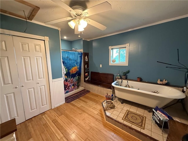 2650 Georgeville Rd, S Mahoning/Plumville, PA 15759 - full bathroom with wood finished floors, ceiling fan, a freestanding bath, wainscoting, and ornamental molding