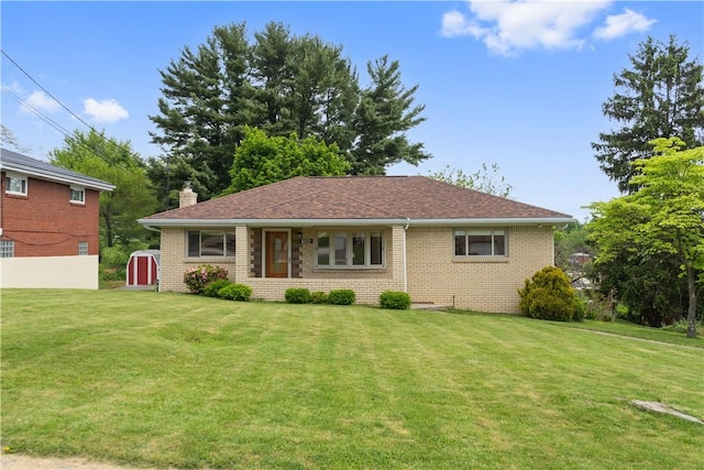 106 High St, Elizabeth Twp/Boro, PA 15037 - view of front facade with a front lawn, brick siding, and a chimney