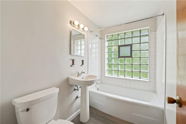 106 High St, Elizabeth Twp/Boro, PA 15037 - bathroom with toilet, wood finished floors, washtub / shower combination, and a sink