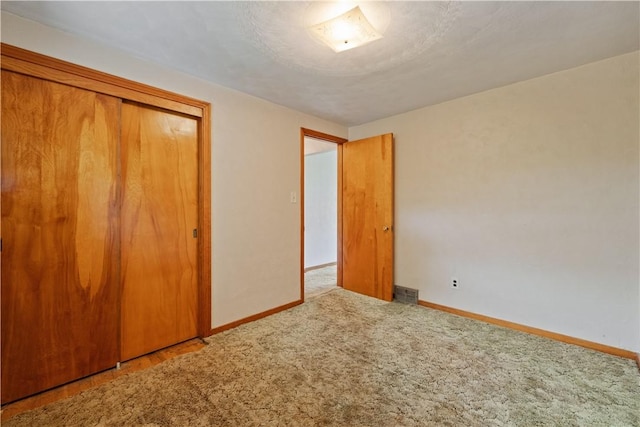 106 High St, Elizabeth Twp/Boro, PA 15037 - unfurnished bedroom with baseboards, a closet, and carpet floors
