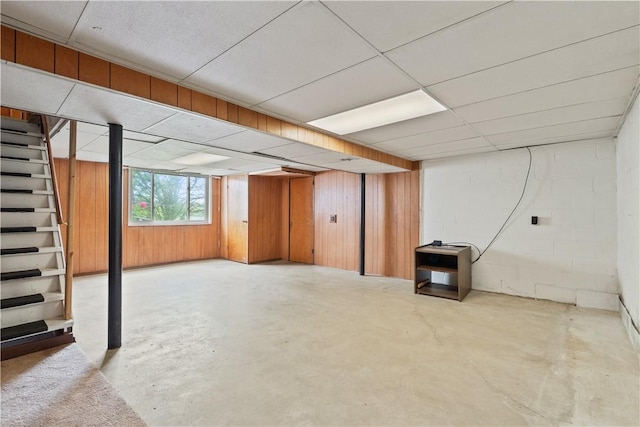 106 High St, Elizabeth Twp/Boro, PA 15037 - below grade area with stairway, a drop ceiling, and wooden walls