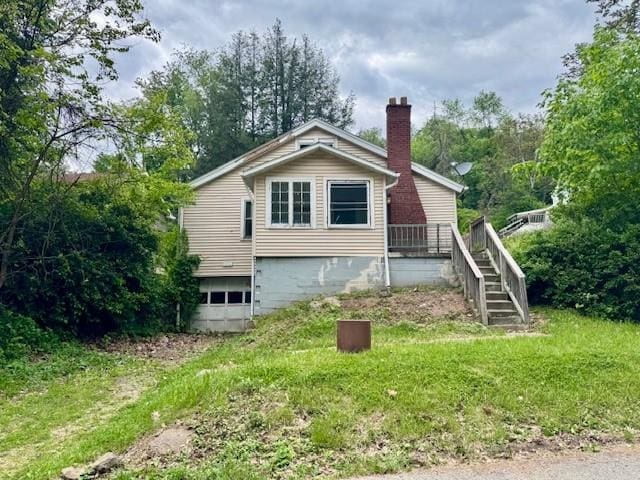 15 Allen Way, White Oak, PA 15131 - view of property exterior featuring a chimney, a garage, and stairs