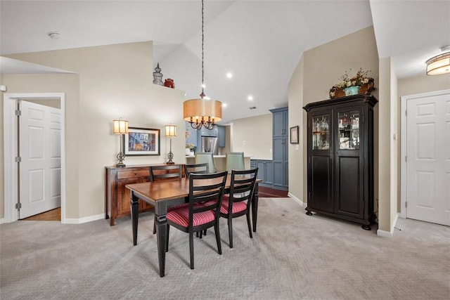 2053 Isleworth, Cranberry Twp, PA 16066 - dining room with light carpet, lofted ceiling, a chandelier, and baseboards