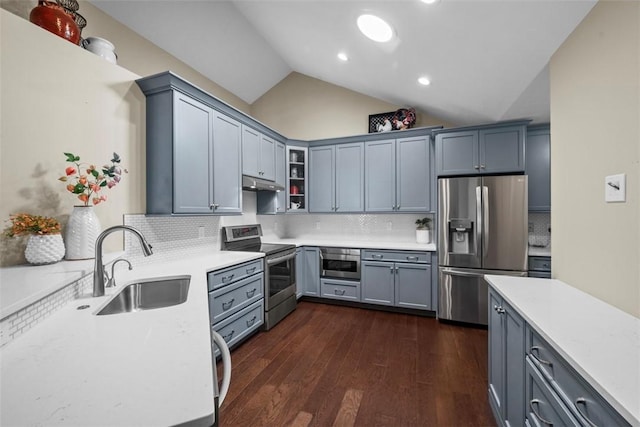 2053 Isleworth, Cranberry Twp, PA 16066 - kitchen featuring appliances with stainless steel finishes, under cabinet range hood, a sink, light countertops, and backsplash