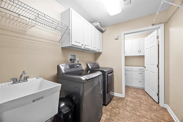 2053 Isleworth, Cranberry Twp, PA 16066 - clothes washing area with washer and dryer, cabinet space, and baseboards