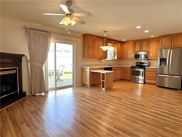 36 Amy Lyne Dr, Smithfield, PA 15478 - kitchen with appliances with stainless steel finishes, light countertops, recessed lighting, light wood-style floors, and hanging light fixtures