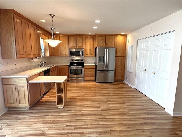36 Amy Lyne Dr, Smithfield, PA 15478 - kitchen with appliances with stainless steel finishes, brown cabinets, light countertops, recessed lighting, and light wood-style floors