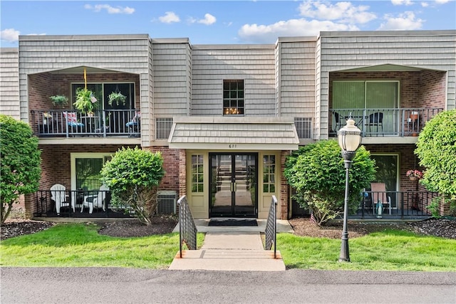 611 Calais Dr Unit 4108, Mccandless, PA 15237 - view of front of home featuring brick siding, central air condition unit, a balcony, and french doors